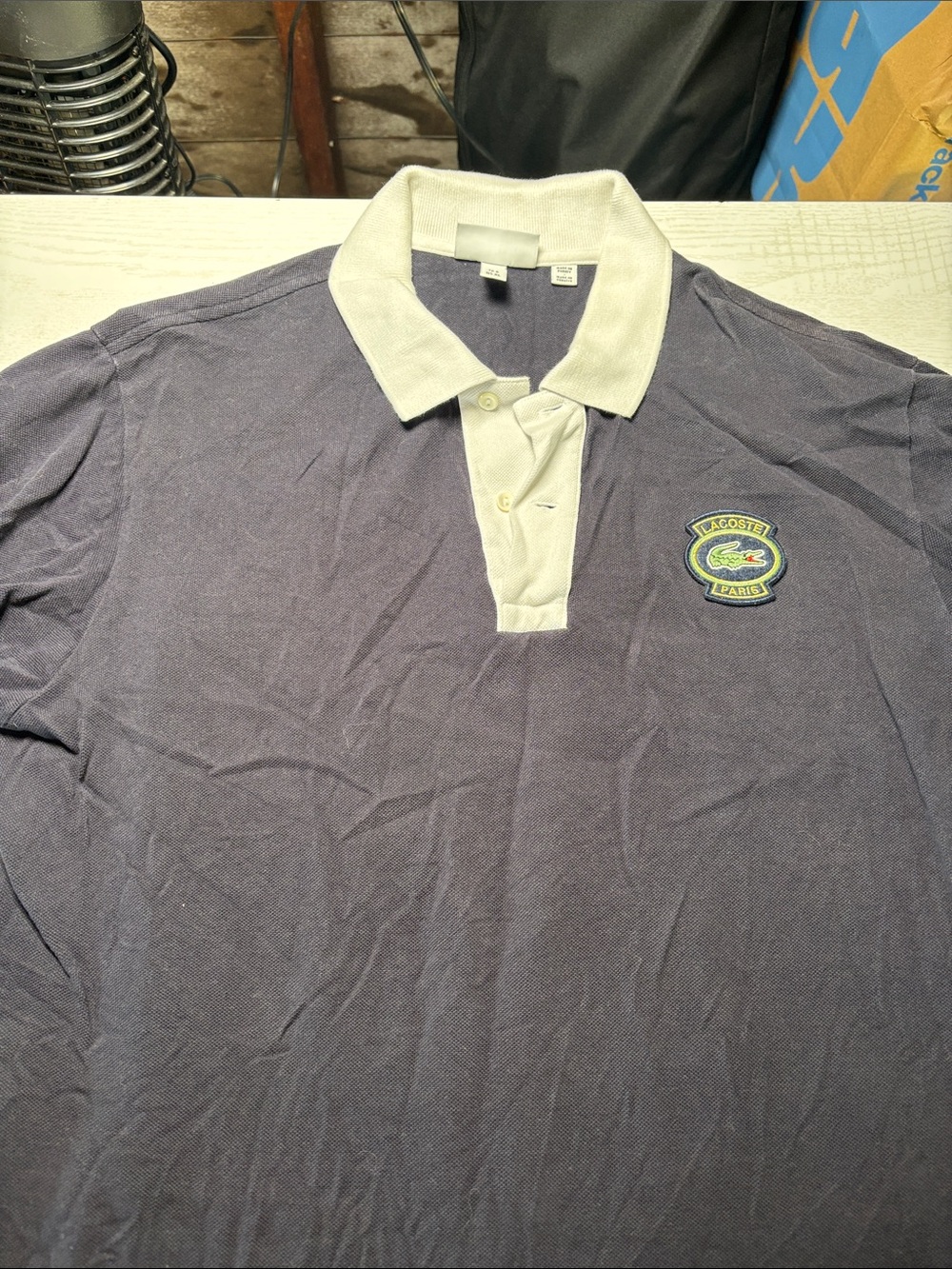 Lacoste Men’s Navy Polo with White Collar and Crest Emblem